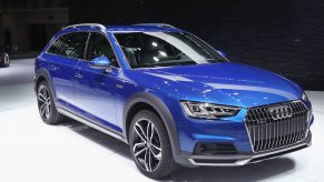 A blue Audi A4 Allroad wagon on display at an auto show