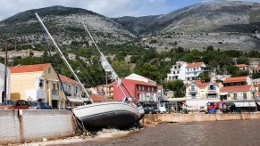 Sailing yachts are stranded in the harbour after the heavy autumn storm "Ianos" at the quay wall. The so-called Medicane, a Mediterranean hurricane, and another storm over the North Aegean Sea caused severe damage and destruction