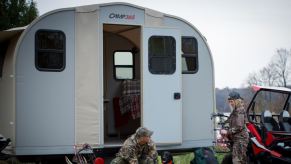 The Camp 365 transforming RV trailer is unfolded and set up as a cabin.