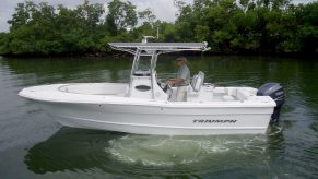 A center console boat riding in a creek