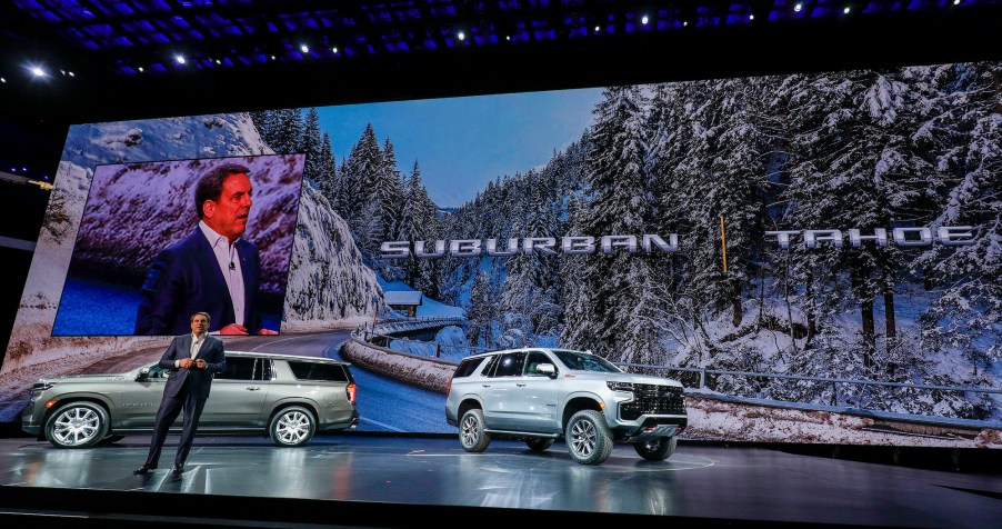 The new 2021 Chevrolet Suburban (left) and 2021 Tahoe (right) SUVs at their reveal at Little Caesars Arena