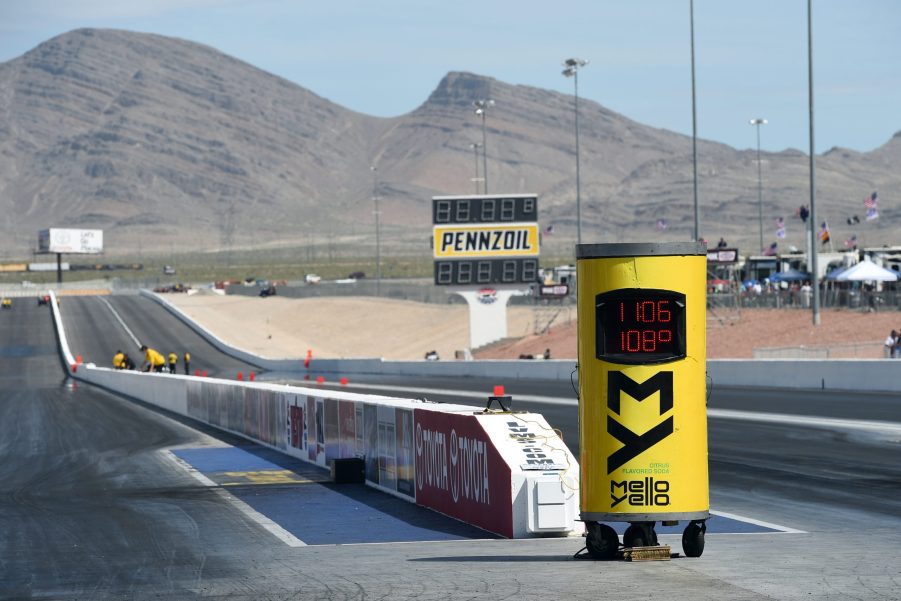 A drag strip stands ready for action against a mountain backdrop.