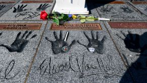 Momentoes including a rose, guitar picks and a cigarette are left on the handprints at the Guitar Center in Hollywood, California of rock guitarist Eddie Van Halen on October 6, 2020. - Van Halen placed his hands in the cement and was inducted into the Hollywood, California RockWalk on November 13, 1985. Eddie Van Halen, the guitar virtuoso whose group is considered one of the greatest rock bands of all time, died on October 6, 2020 following a long battle with cancer, his son announced. (Photo by Frederic J. BROWN / AFP) (Photo by FREDERIC J. BROWN/AFP via Getty Images)