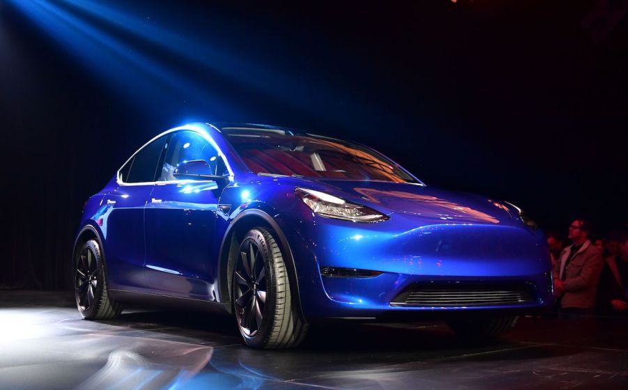 An image of a Tesla Model Y on a stage.