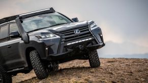 The front of the Lexus J201 Concept traversing dirt.