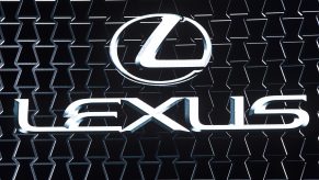 The Lexus logo on display at an auto show