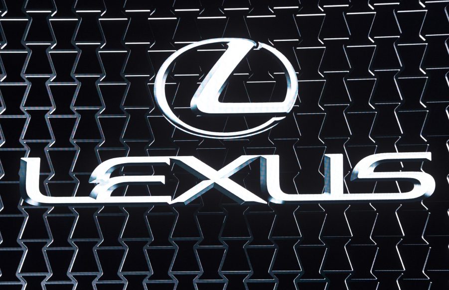 The Lexus logo on display at an auto show