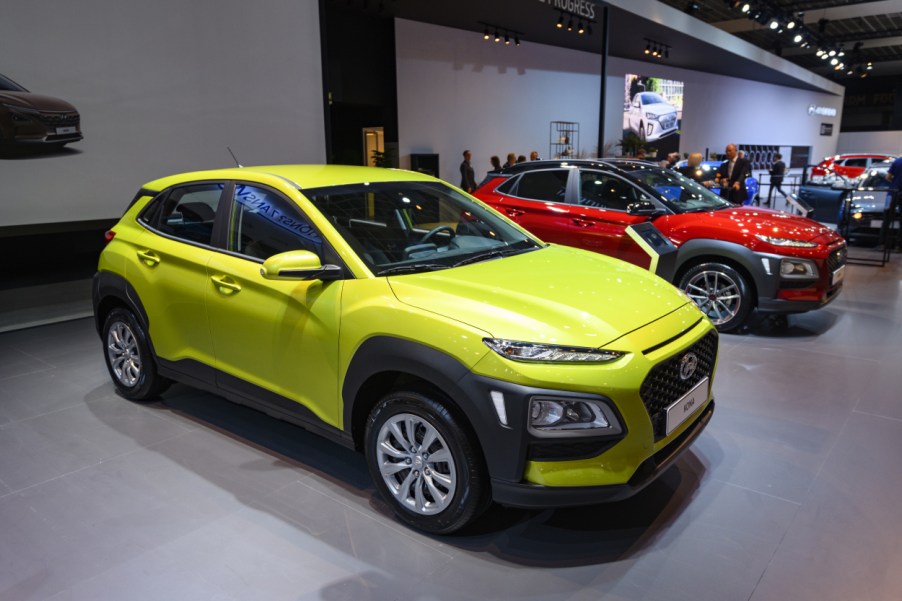 A green Hyundai Kona on display at an auto show