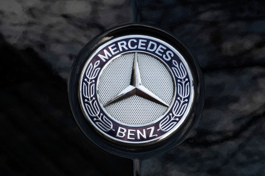 Mercedes logo seen on the hood of a black car.