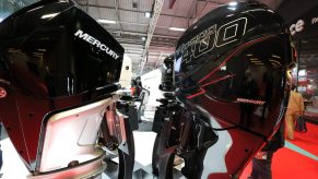 A picture taken on December 9, 2018 shows boat motors of the manufacturer Mercury, rival to Yamaha, on display during the Paris International Boat Show