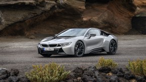 An image of a BMW i8 parked outside on display.