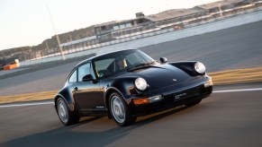 A photo of a vintage Porsche 911 on track.