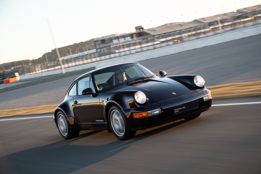 A photo of a vintage Porsche 911 on track.