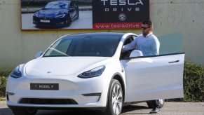 A picture taken on September 5, 2020 shows a driver testing a "Tesla Model Y" car, an all-electric compact SUV by US electric car giant Tesla