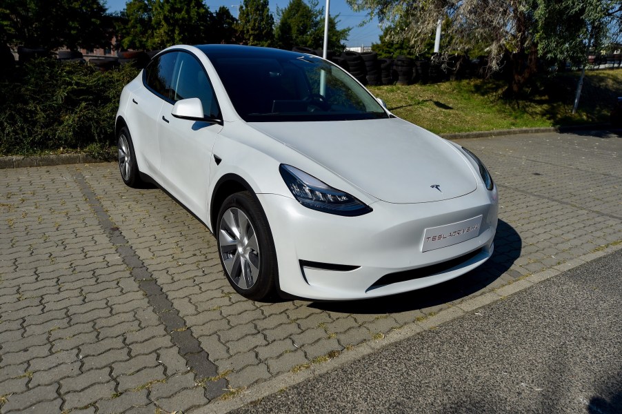 A picture taken on September 5, 2020 shows a "Tesla Model Y" car, an all-electric compact SUV by US electric car giant Tesla, during its presentation at the Automobile Club