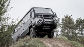 A gray Torsus Praetorian climbs an off-road hill