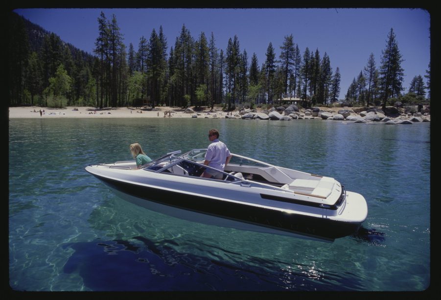 A Bayliner Maxum boat on crystal clear water.