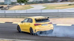 A photo of the Mercedes-AMG A 45 S utilizing its drift mode on track.