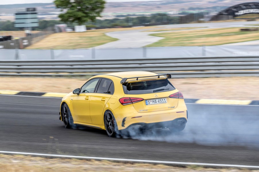 A photo of the Mercedes-AMG A 45 S utilizing its drift mode on track.