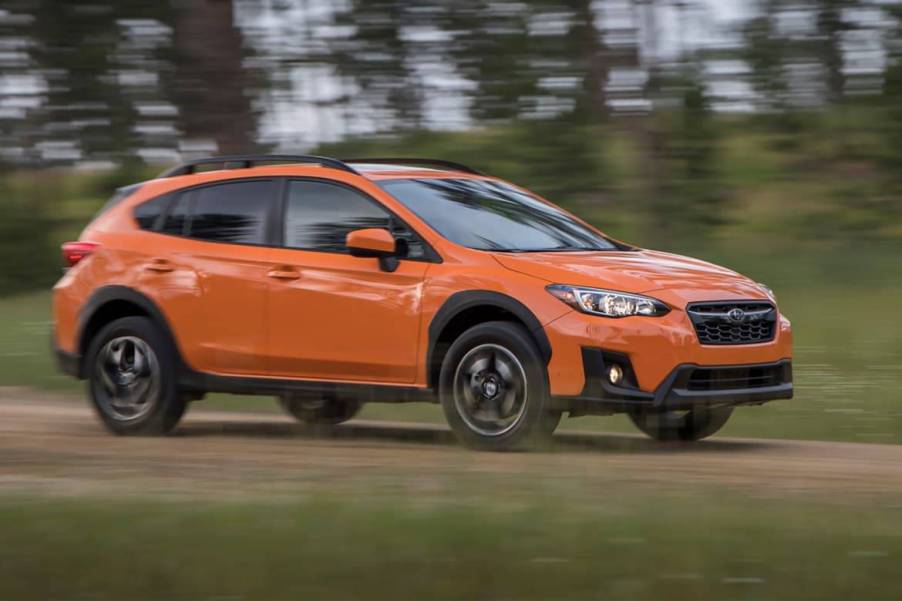 A orange 2019 Crosstrek on the track.