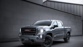 A gray 2020 GMC Sierra 1500 parked in front of a gray wall