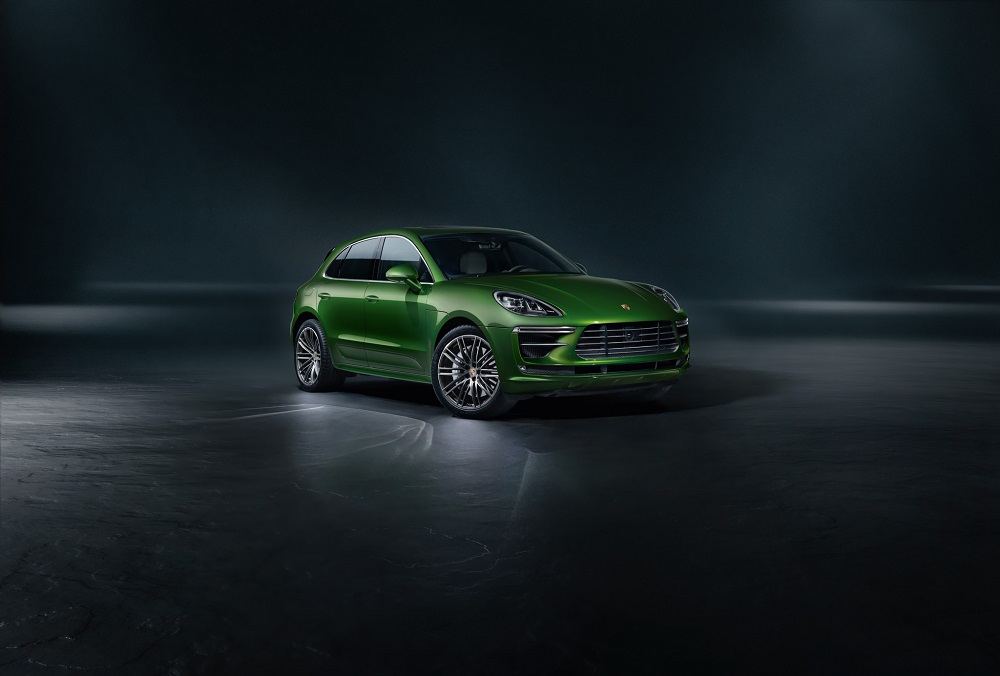 A green 2020 Porsche Macan on display