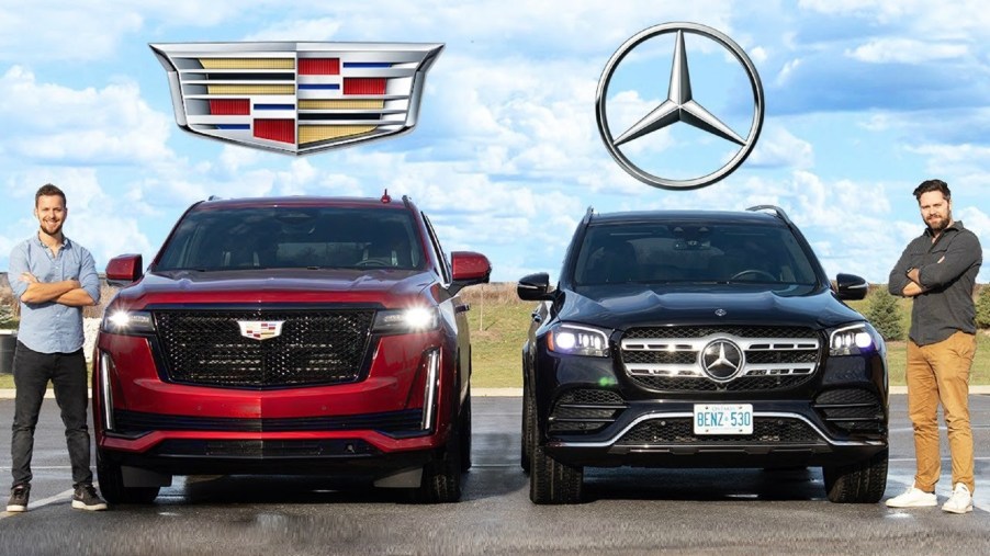 A red 2021 Cadillac Escalade Sport Platinum next to a black 2020 Mercedes-Benz GLS 580 4Matic