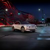 A white 2021 Ford Mustang Mach-E parked on a city street