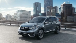 A gray 2021 Honda CR-V Touring in a city