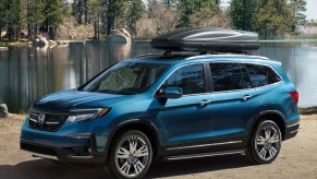 An electric blue 2021 Honda Pilot on the track.