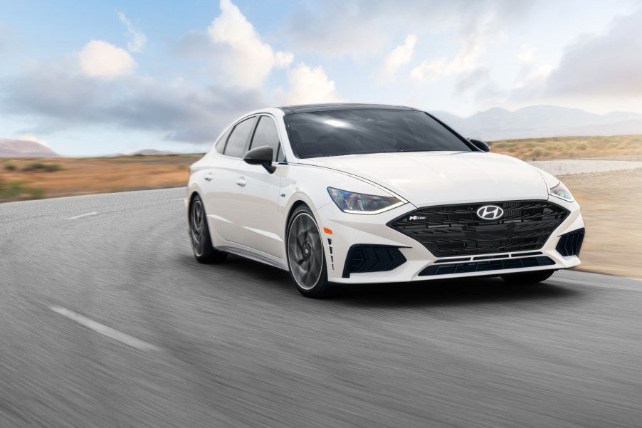 A white 2021 Hyundai Sonata N Line driving on a road