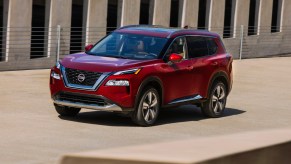 A red 2021 Nissan Rogue compact SUV on display