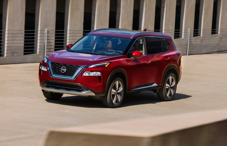 A red 2021 Nissan Rogue compact SUV on display