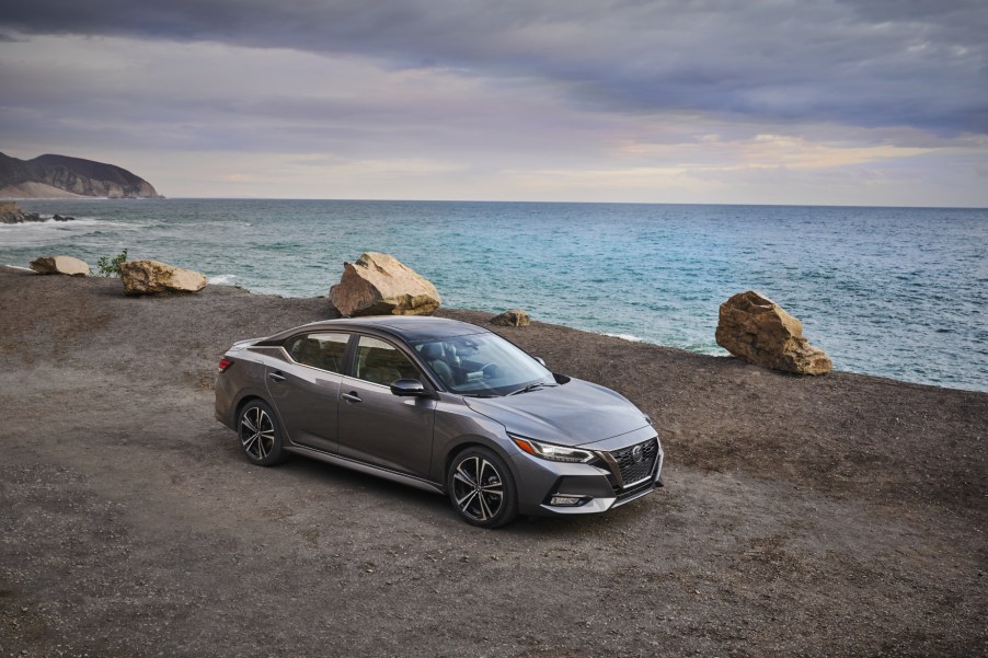 A silver 2021 Nissan Sentra parked by the water