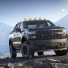 A black 2021 SVE Yenko Chevrolet Silverado Off-Road climbs a mountain