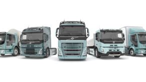 Five heavy-duty trucks are lined up to represent Volvo's all-electric offerings.