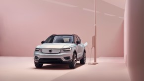 A silver 2021 Volvo XC40 Recharge connected to a charging port