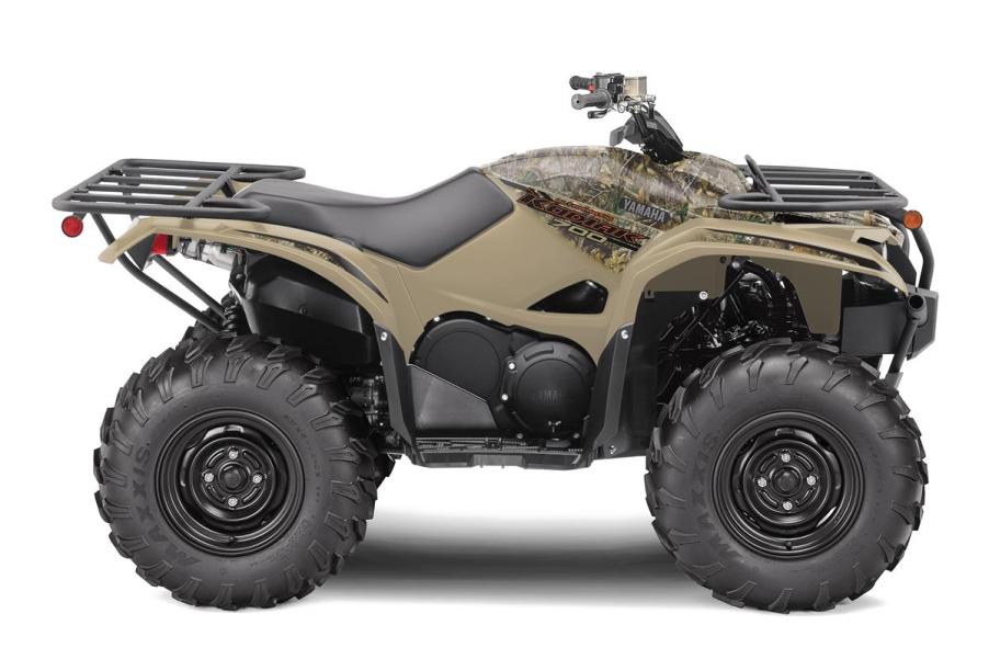 a studio photo of a tan Yamaha Kodiak 700 against a white backdrop