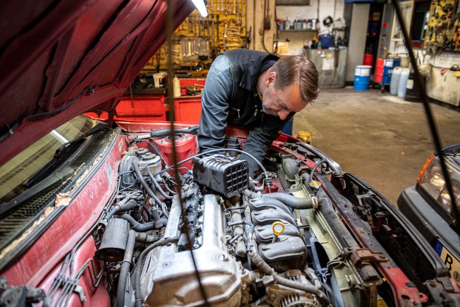 Car mechanic doing repair work