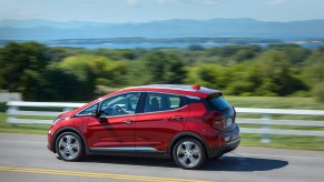 Chevrolet Bolt EV driving past the mountains