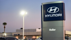 Cars are seen at a Hyundai car dealership. Hyundai and Kia announced on October 11, 2019 that they have agreed to settle a class action lawsuit over engine fireshttps://develop.motorbiscuit.com/the-hyundai-veracruz-walked-so-the-hyundai-santa-fe-could-run/