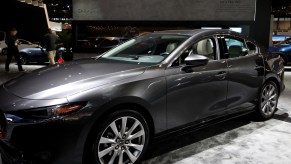 A Mazda3 on display at an auto show