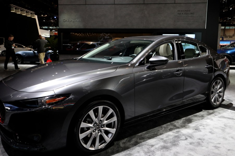 A Mazda3 on display at an auto show