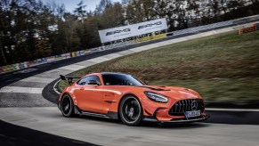 An orange 2021 Mercedes-AMG GT Black Series driving on the Nürburgring