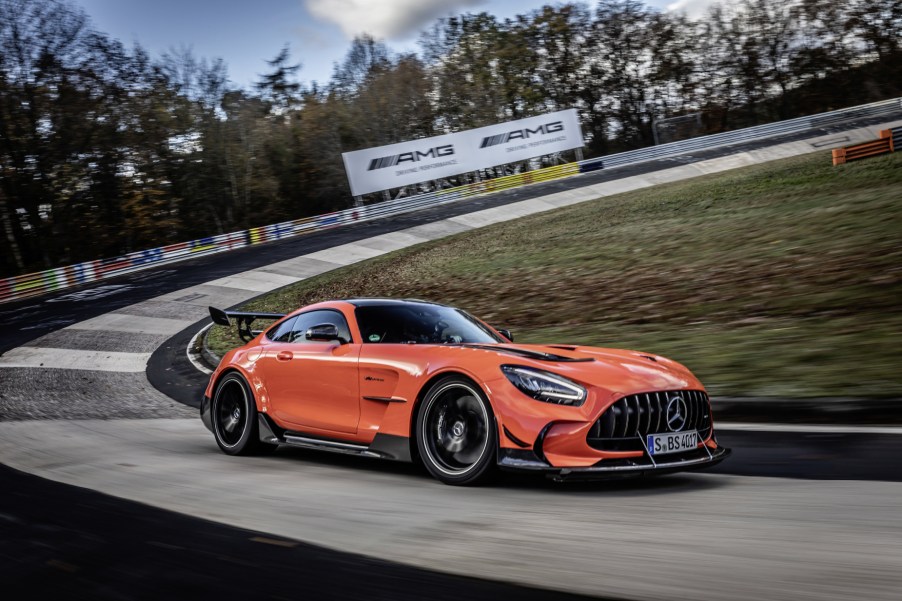 An orange 2021 Mercedes-AMG GT Black Series driving on the Nürburgring