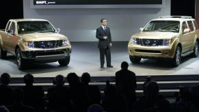 Carlos Ghosn, President and CEO of Nissan Motor Company introduces the new 2005 Frontier (L) and Pathfinder (R) during the press days 05 January 04 at the North American International Auto Show