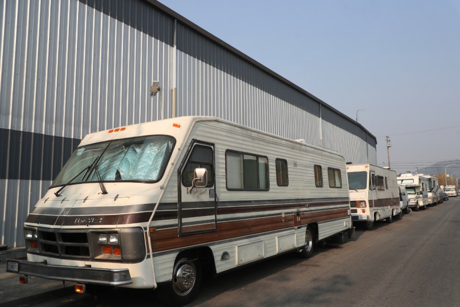 RVs parked along the side of a building