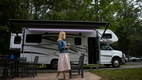 Washington Post travel writer Andrea Sachs stands outside of her rented RV Saturday, September 19, 2020 at a KOA campground in Fredericksburg, Virginia.