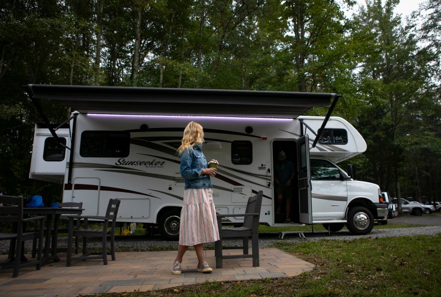 Washington Post travel writer Andrea Sachs stands outside of her rented RV Saturday, September 19, 2020 at a KOA campground in Fredericksburg, Virginia.