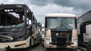 Motorhomes at an RV salvage yard